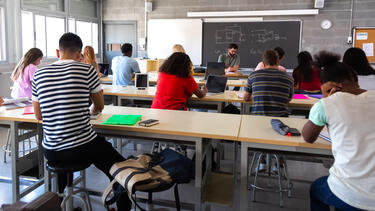 Students of various races in a classroom