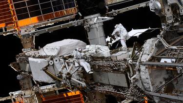 Astronauts working on the International Space Station