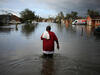 A resident walking through flooding from Hurricane Ida in LaPlace, Louisiana, on August 30, 2021